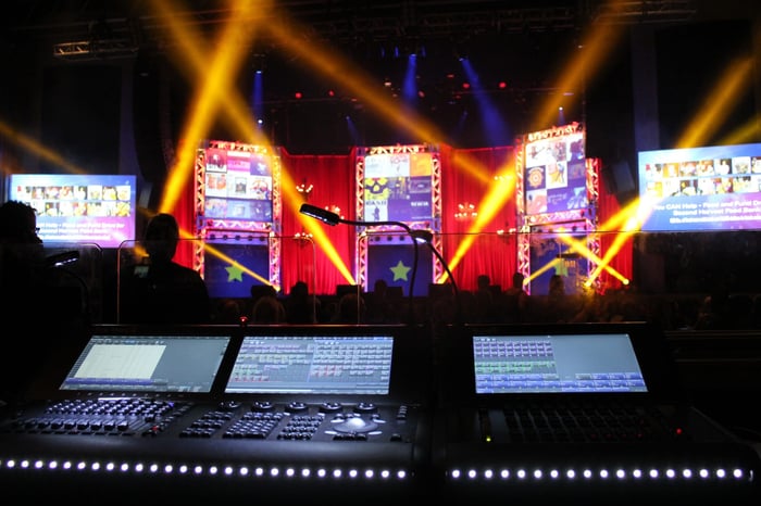 the console where a LD sits to control all of the lights at a live event